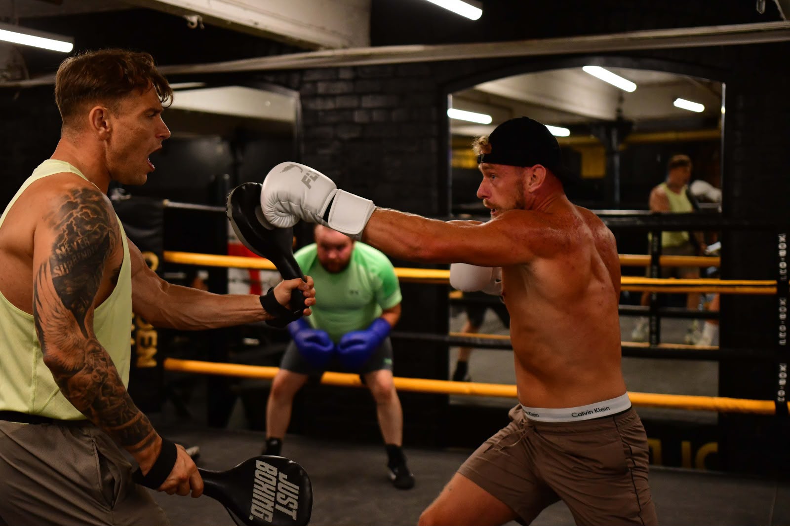 Pad work during a Pembo boxing session